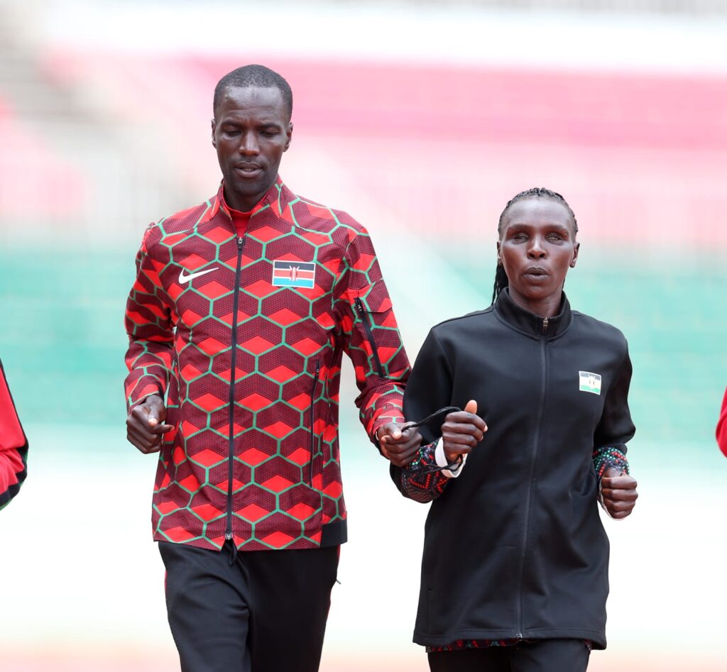 Priscah Jepkemei (1,500m T11) and her guide Kenneth Lagat