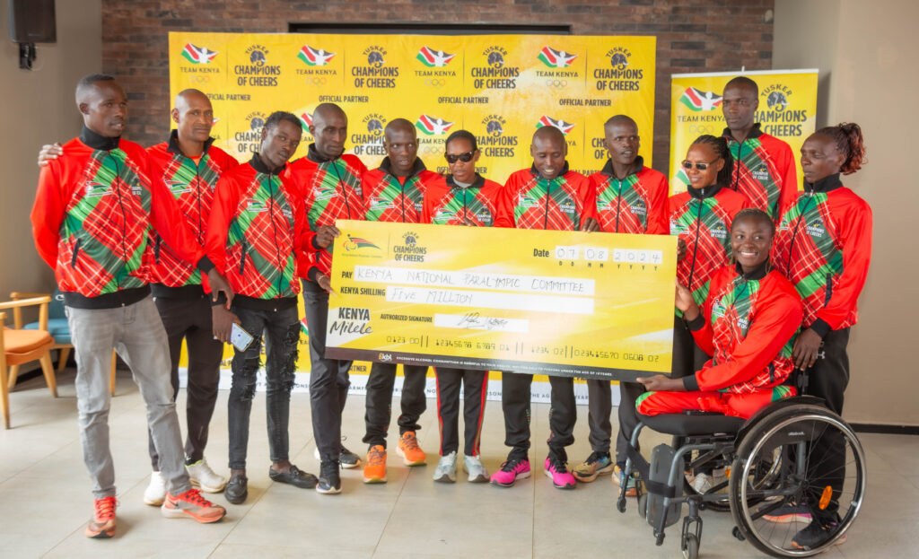 KBL MD Mark Ocitti pose for a photo with the Kenya National Paralympic Team following the company's sponsorship to KNPC